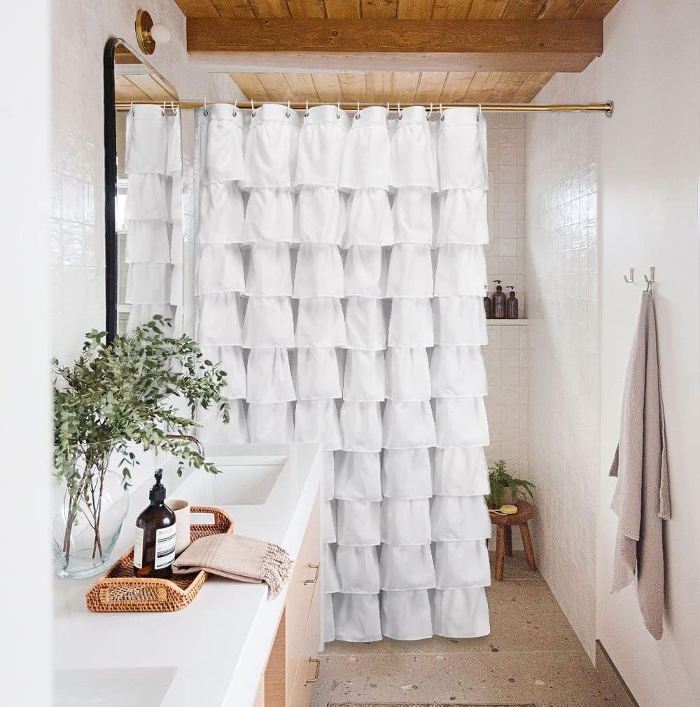 Volens white shower curtain machine-washable for simple maintenance.