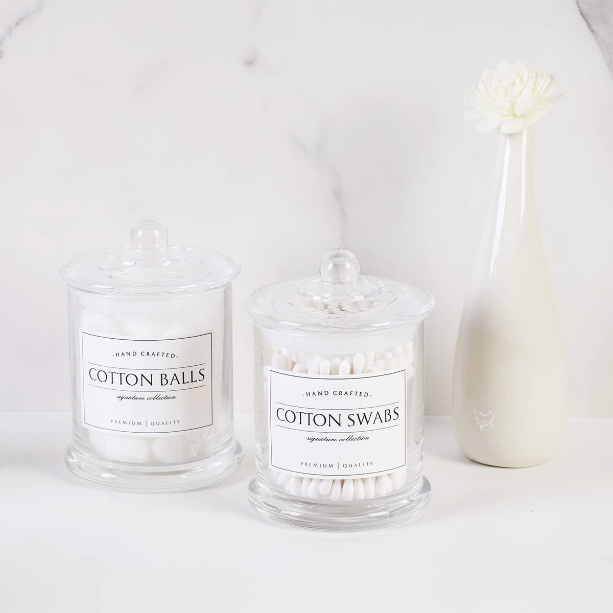 Volisnova farmhouse jar with clear glass for cotton rounds on a serene bathroom counter.