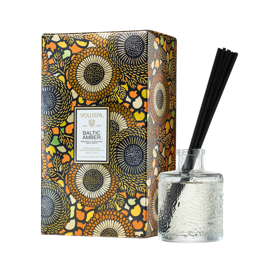 Voluspa Baltic Amber diffuser with reeds in frame promotes subtle luxury in living spaces