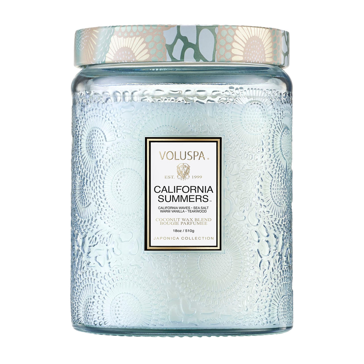 Voluspa California Summers candle in embossed glass jar enhances home ambiance.