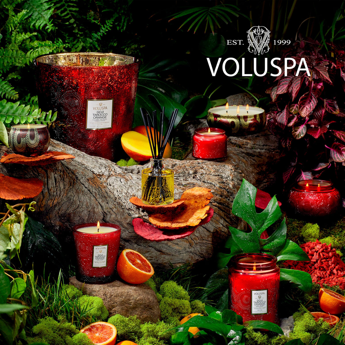Voluspa Goji Tarocco Orange diffuser near a candle creates inviting ambiance.