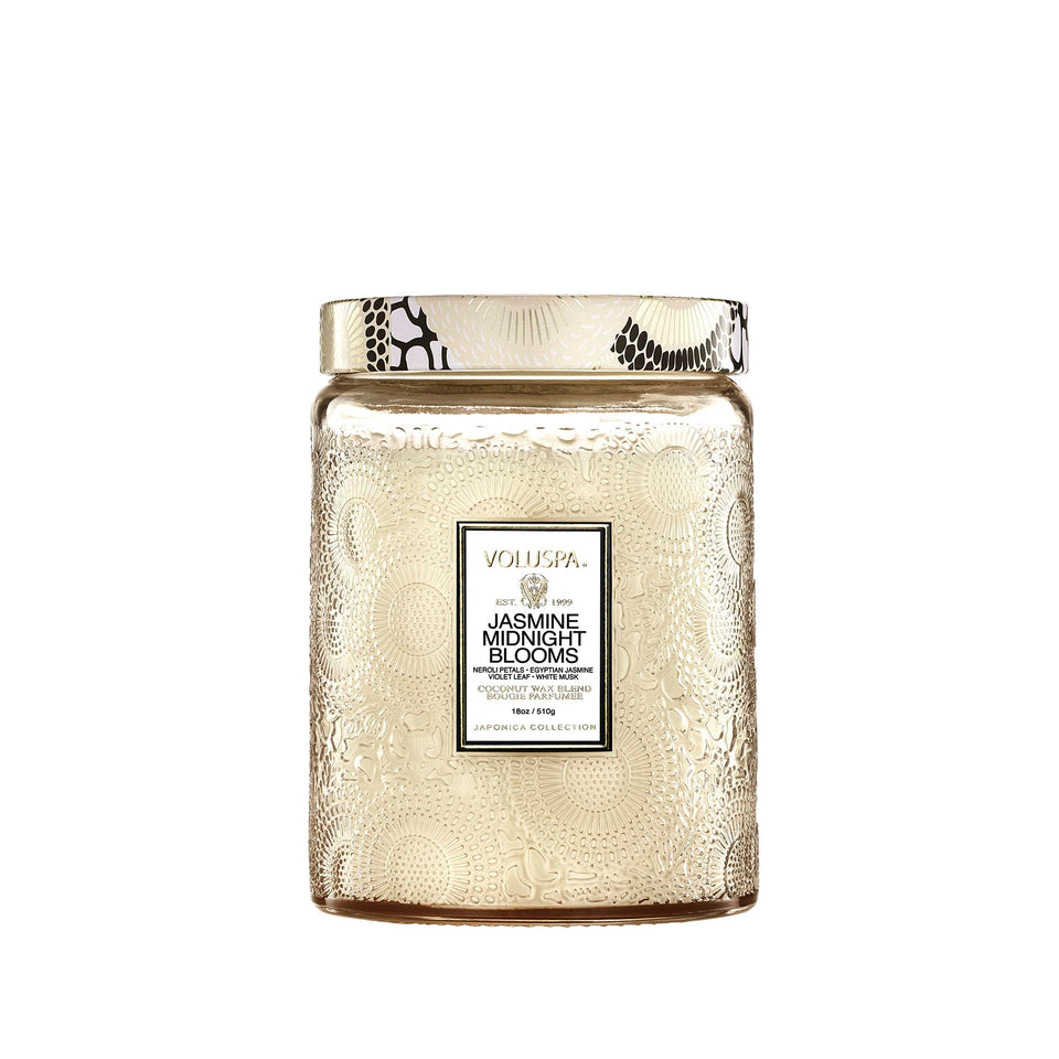 Voluspa Jasmine Midnight Blooms glass jar closeup, showcasing elegant design for ambient evenings.