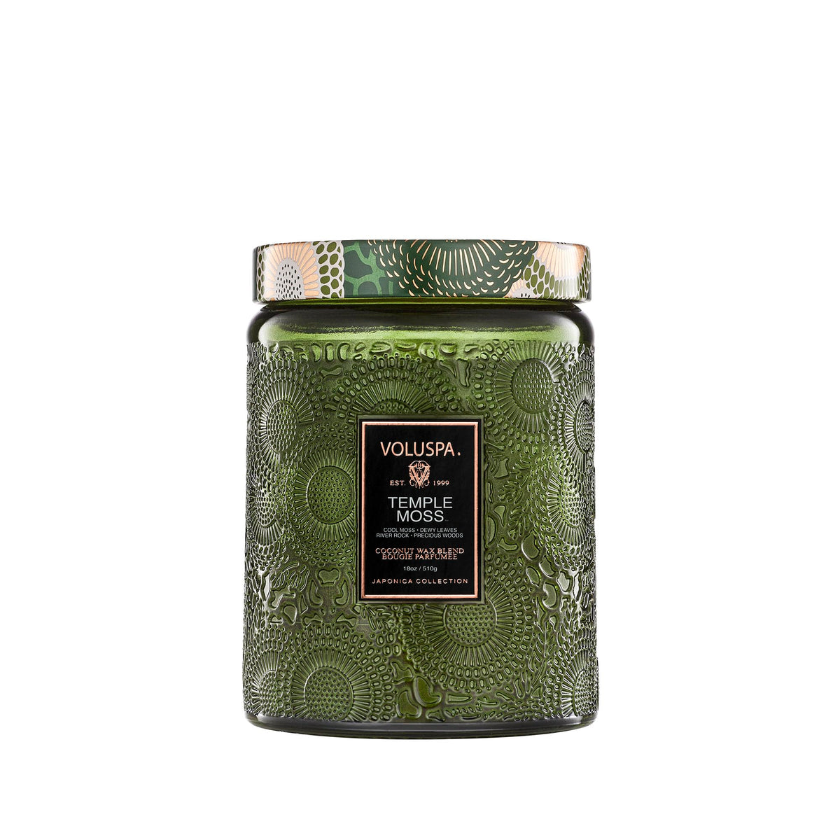 Voluspa Temple Moss candle jar with warm earthy scent for calm evenings.