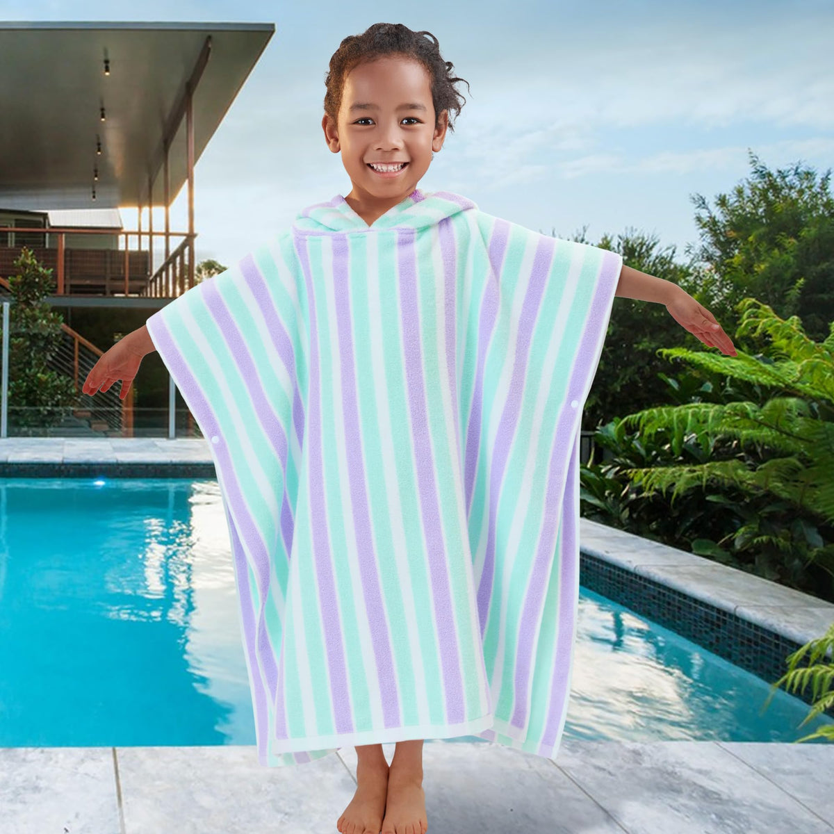 VOOVA & MOVAS cabana-striped-design-poncho-towel adds timeless style to summer outfits.