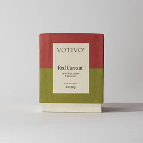Votivo Red Currant candle in room decor setting offers ambiance
