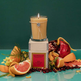 Gift-ready packaging for Votivo Red Currant candles with tissue wrap and metal-edged box.