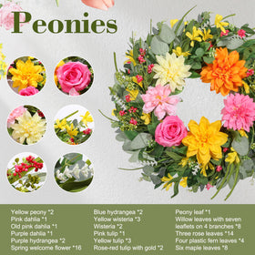 Close-up of silk flowers and realistic greenery on a vine base.