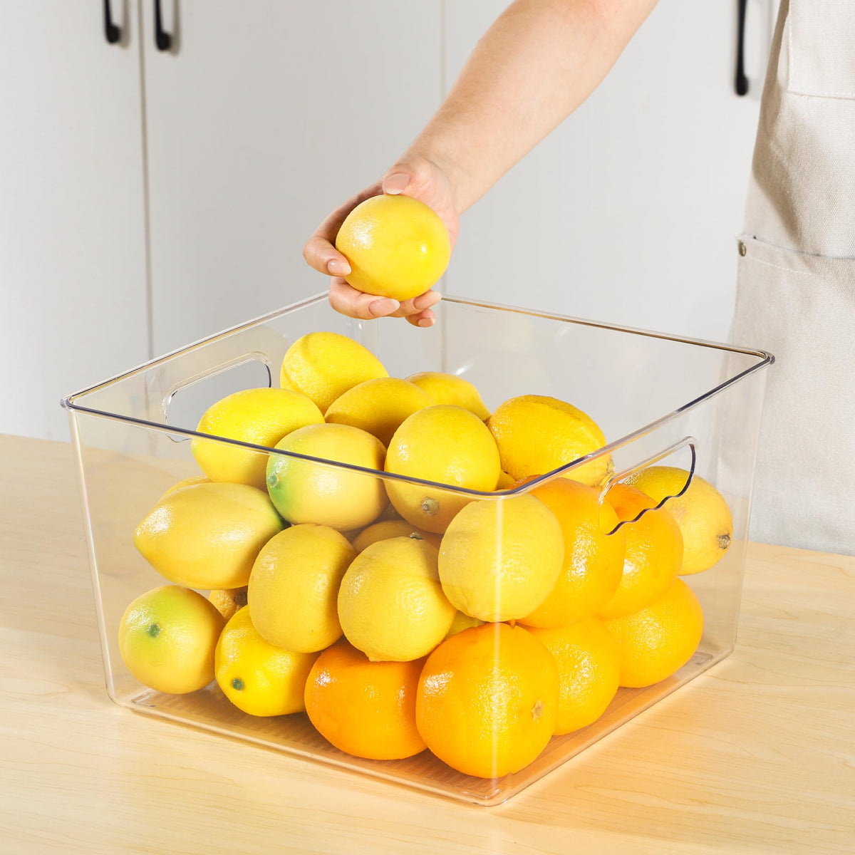 Vtopmart under-sink clear bin keeps items organized and accessible.