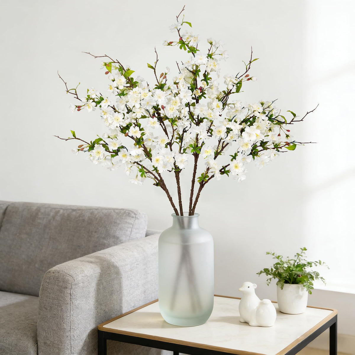 VUAHAUL Easter table styling with white blossoms and greenery