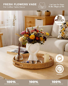 VUZDVJO White ceramic vase heart-hands detail, highlighting delicate craftsmanship and clean lines.