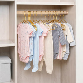 VWV gold hangers support coats and jeans without bending.
