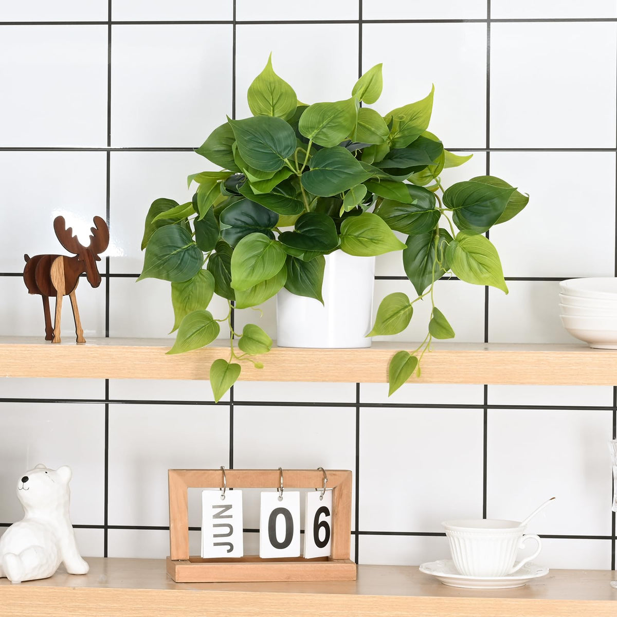 Waipfaru faux plants on a shelf create a calm ambience.