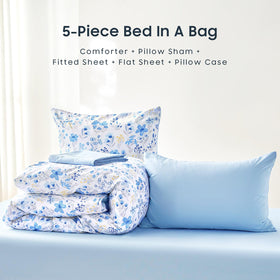 Blue and white floral Wake In Cloud set brightening a kid's bedroom.