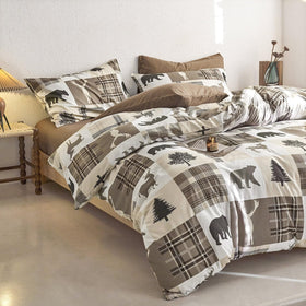 Wake In Cloud plaid accents bedding complements cabin decor beautifully.