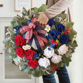 WANNA-CUL handcrafted 4th of July wreath featuring lifelike roses and greenery.