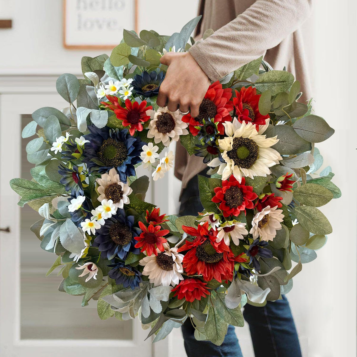 WANNA-CUL wreath featuring eucalyptus and lamb’s ear details for texture.
