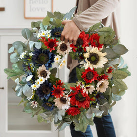 WANNA-CUL wreath featuring eucalyptus and lamb’s ear details for texture.