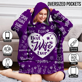 Warmstorey Best Wife Ever hoodie-blanket on bed for morning warmth and comfort.