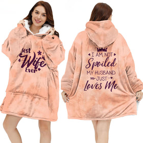 Warmstorey wearable blanket hoodie on a couch offering cozy warmth for her evenings