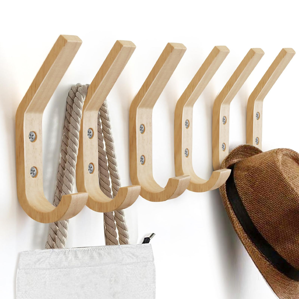 Watbeyoz decorative wall hooks add rustic charm while holding umbrellas and bags.