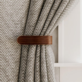 Waveply U-shaped hook holdbacks for secure wall mounting and easy drape management.