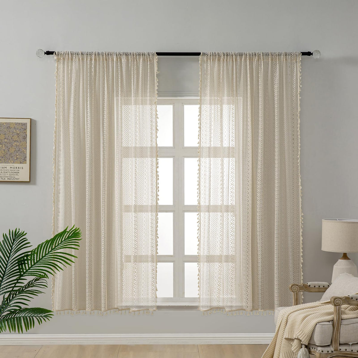 WAZZIO tassel-detail crochet curtains add boho charm as decorative focal point.