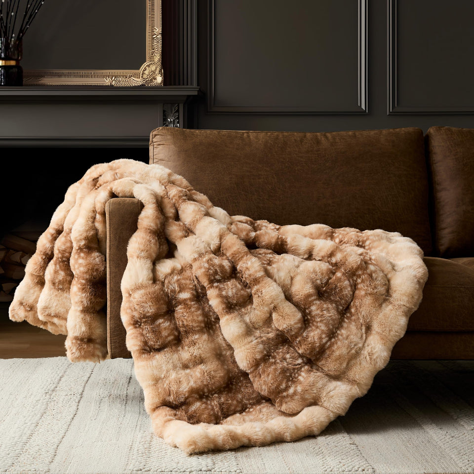 WDCOZY Deer Fawn bubble-throw blanket on a stylish couch adds cozy warmth.