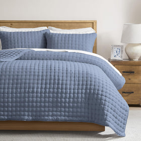 WDCOZY dusty-blue oversized king quilt set drapes beautifully on Cal King bed.