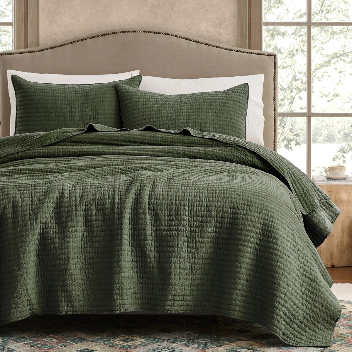 WDCOZY olive-green striped quilt on king bed offering breathable all-season comfort.