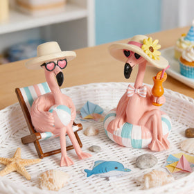 WDS WONDROUS flamingo figurines with beach chair and ball brighten shelves and tables.