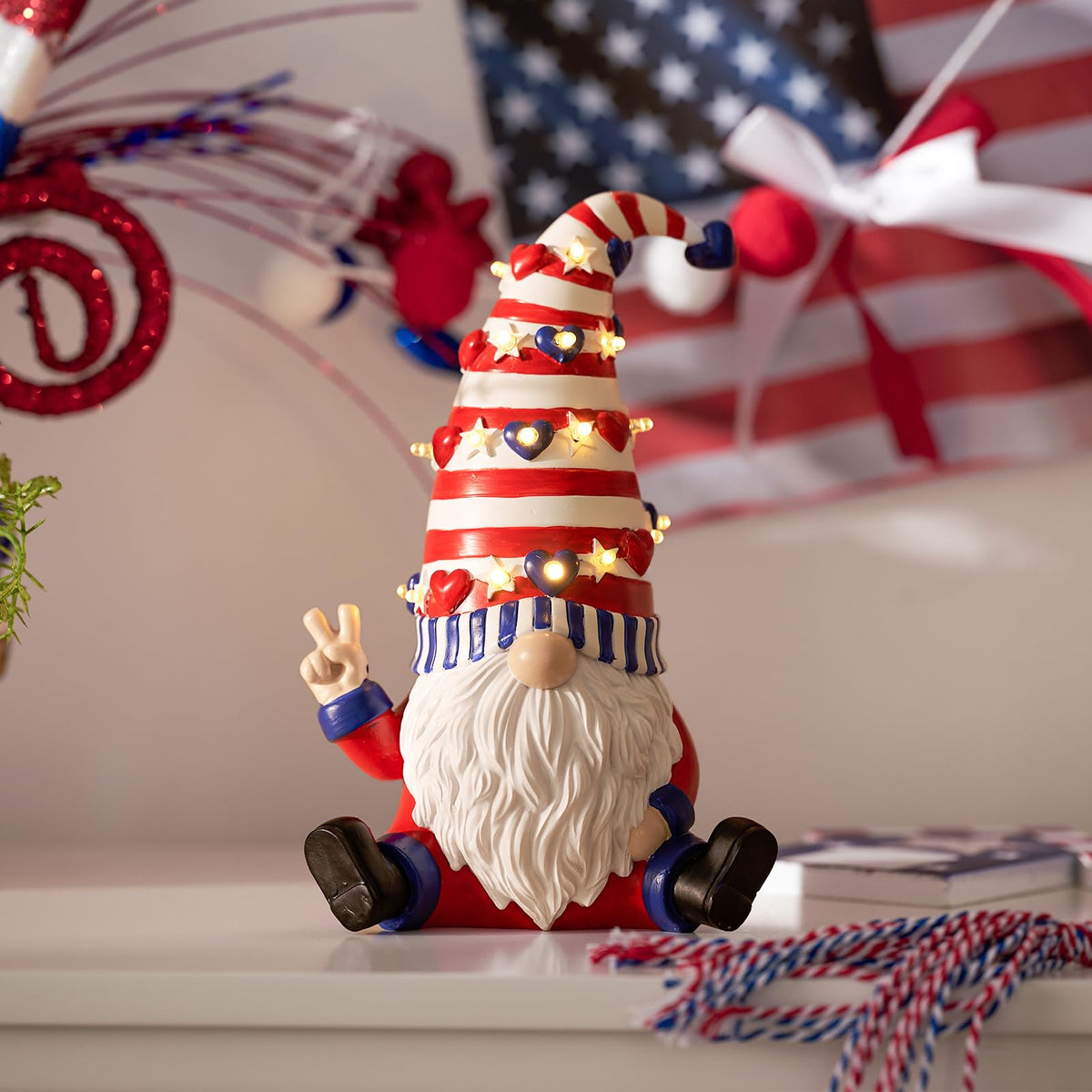 WDS WONDROUS red and blue resin gnome with LEDs brightening tabletops.