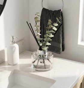 WEALD TRIBE amber glass diffuser bottle delivering fragrance to rooms