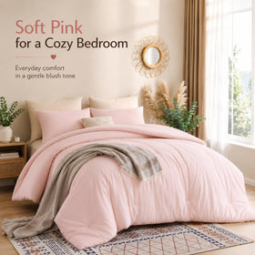 Weigelia blush pink comforter set packaging on bed for cozy dorm room setup.