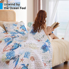 Weigelia pillow cases pair with the quilt for a complete coastal look.