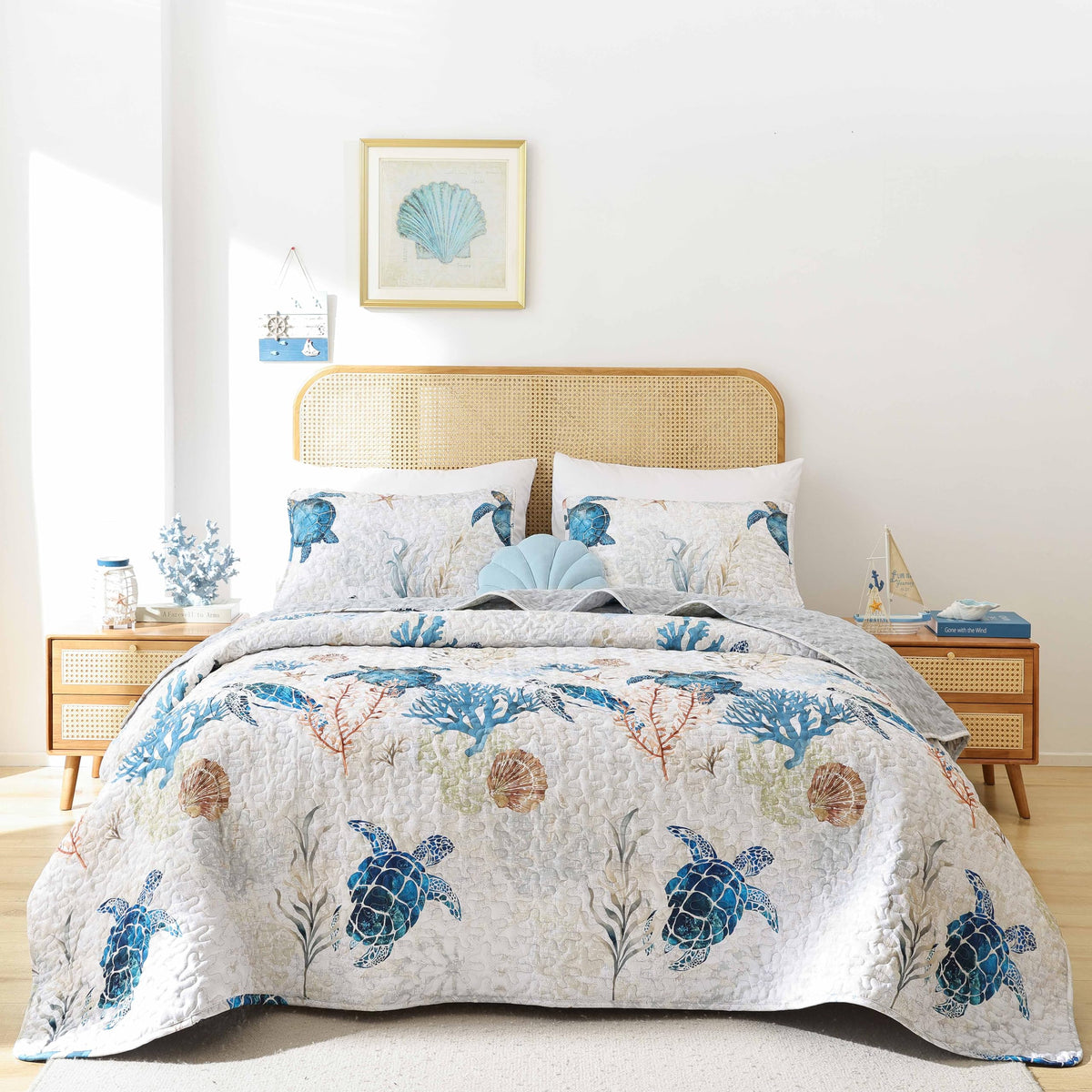 Weigelia coastal quilt sea turtle design on bed creates calming ocean vibes.