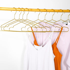 Wesiti gold hanger supports coats and winter garments with style