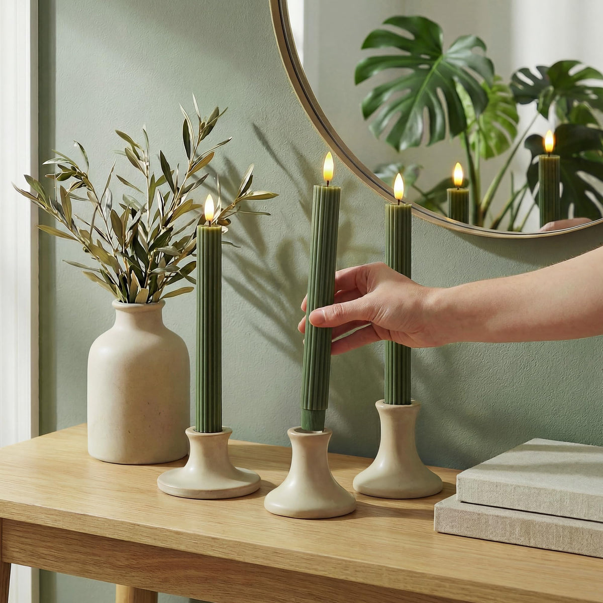 West Ivory remote-controlled LED candle showing brightness and timer options.