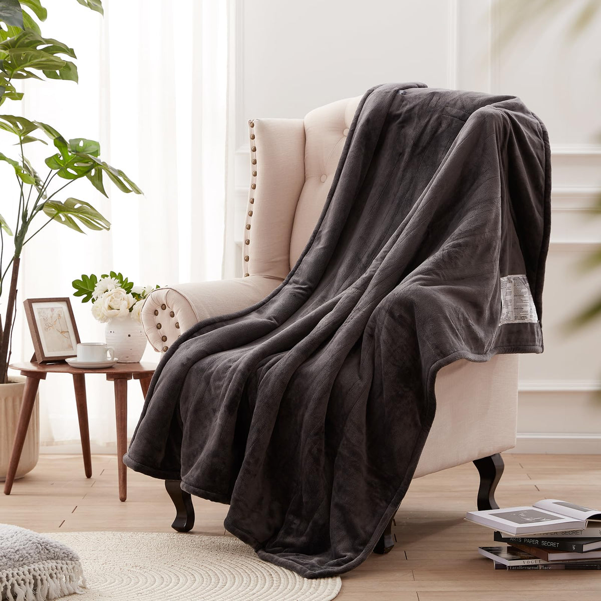 Westinghouse heated blanket throw charcoal draped on sofa for instant warmth