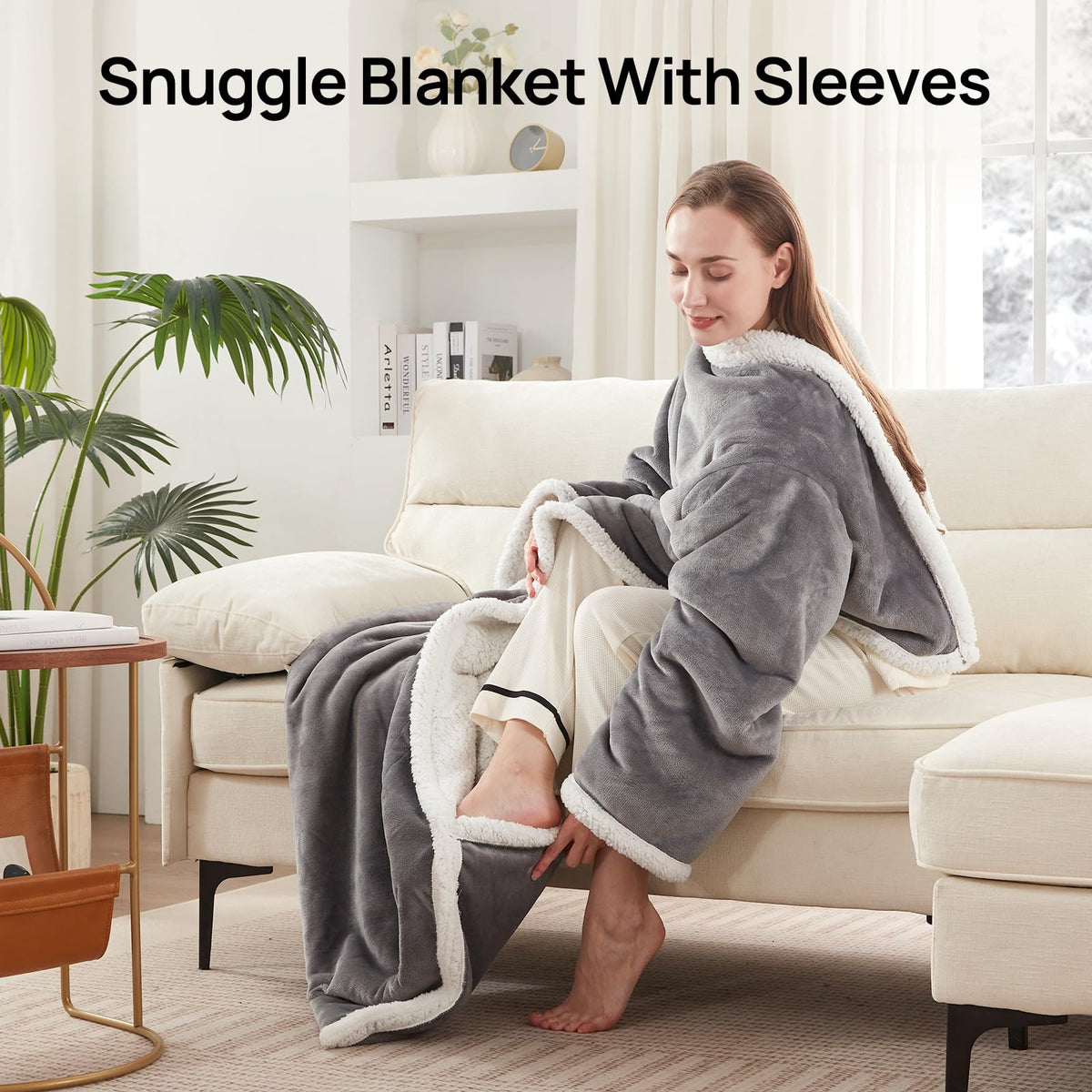 Westinghouse Snuggle Throw worn on sofa for comfortable lounging.