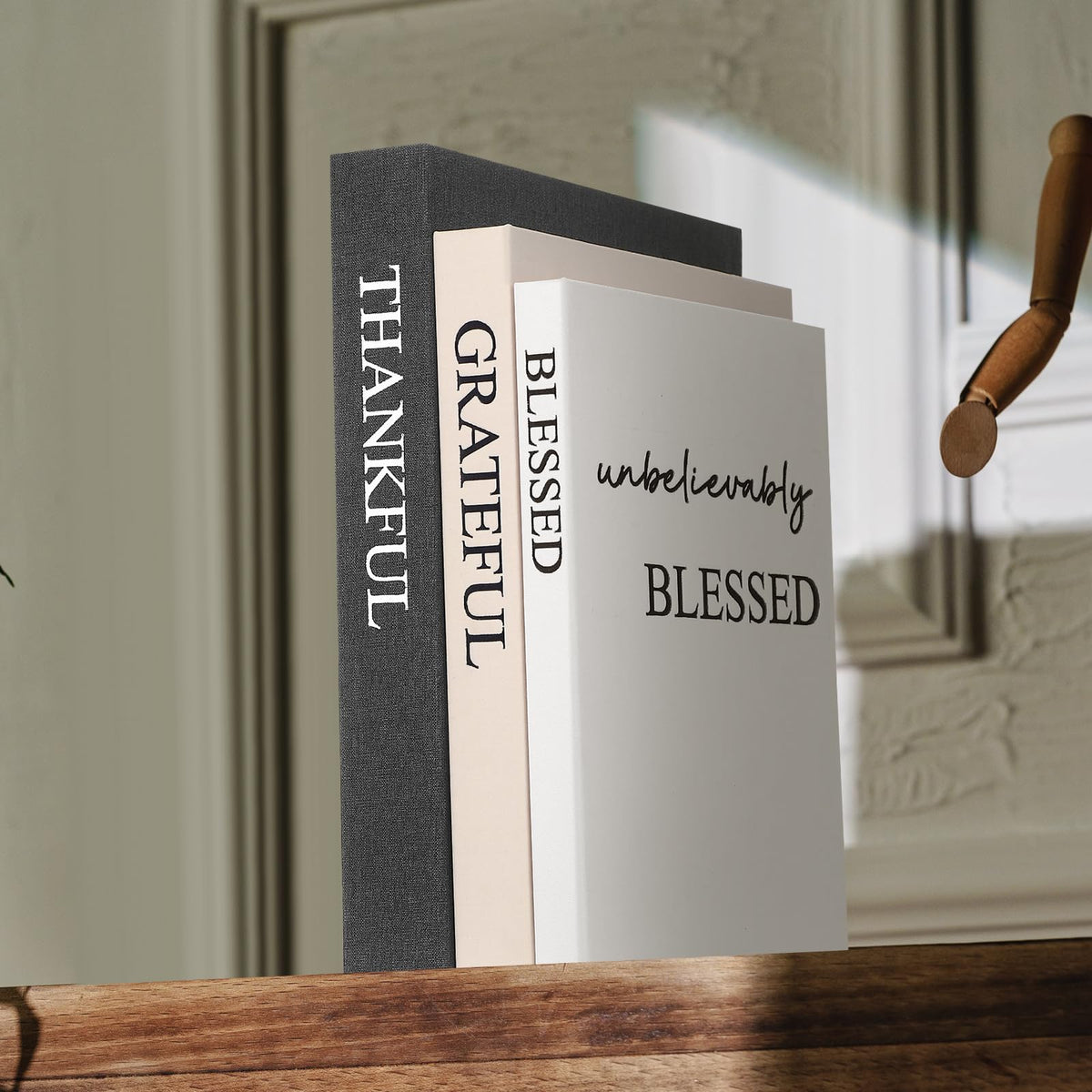 Weysat decorative books arranged on a desk evoke calm, organized workspace aesthetics
