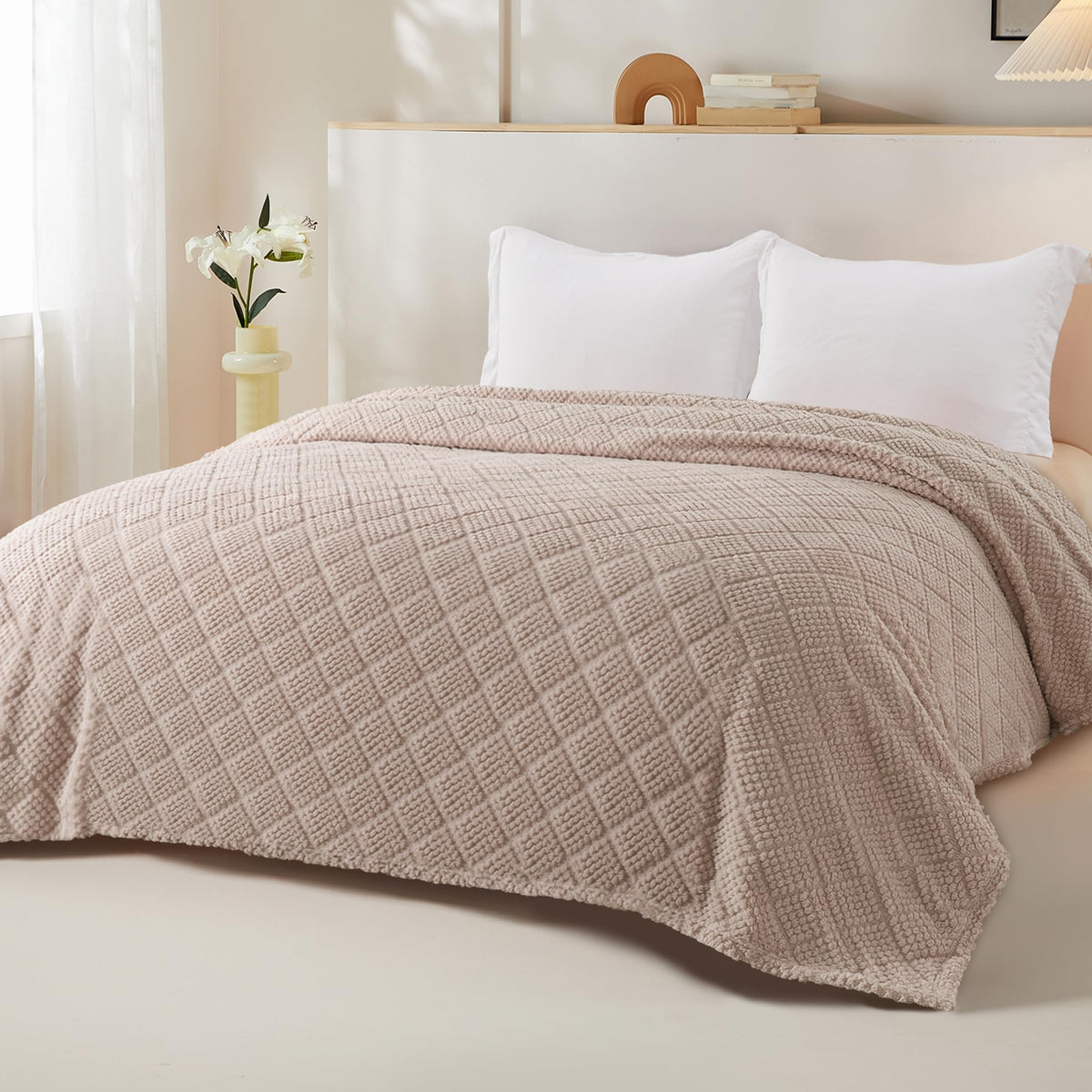 Whale Flotilla bed-spread display shows camel blanket draped for a warm bedroom