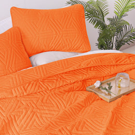 Whale Flotilla bedspread draped over bed creating a cozy focal point