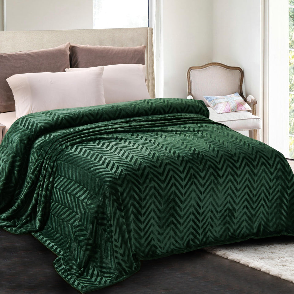 Whale Flotilla emerald green blanket close-up shows plush texture for cozy lounging.