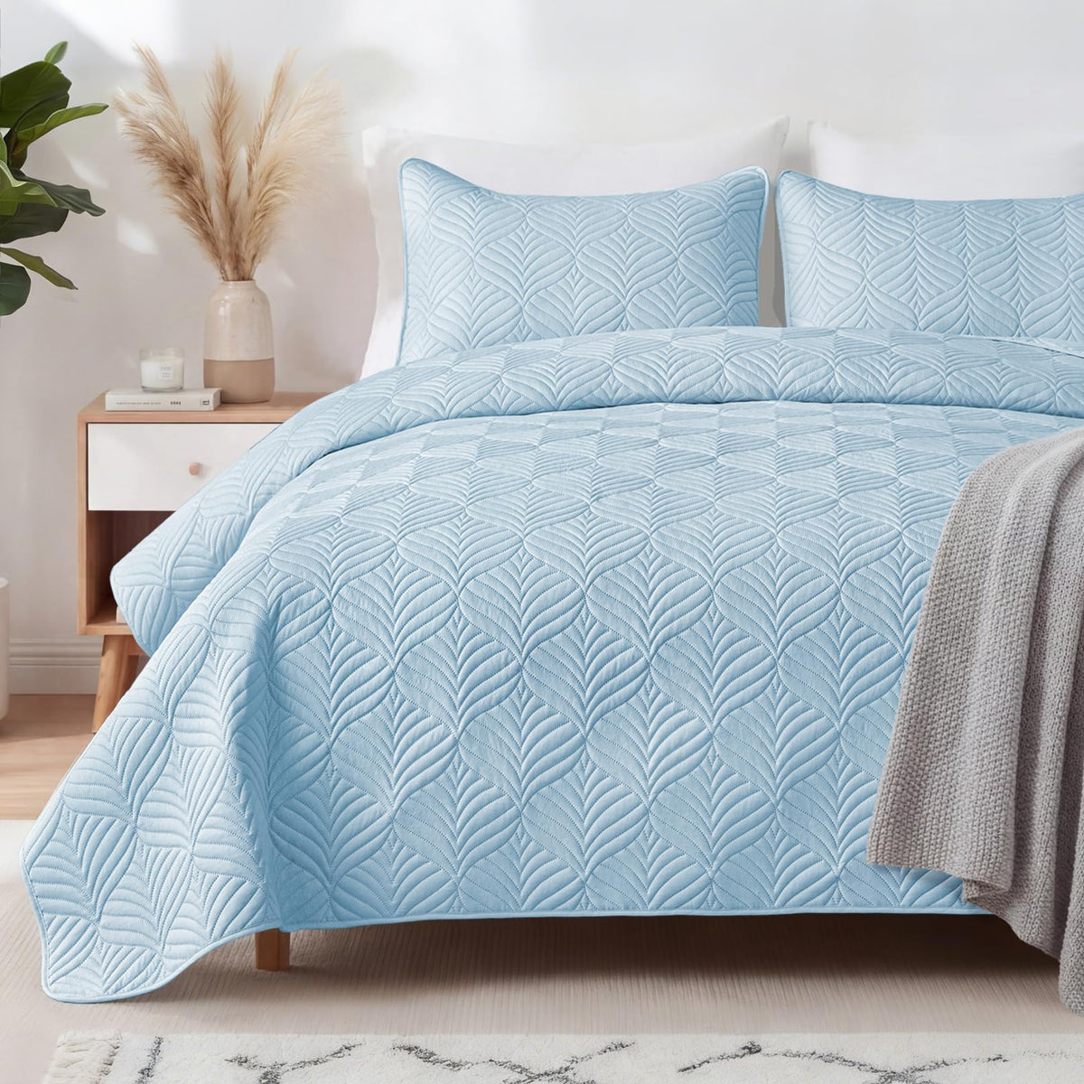 Whale Flotilla quilt with embossed pattern adds elegant bedroom style.