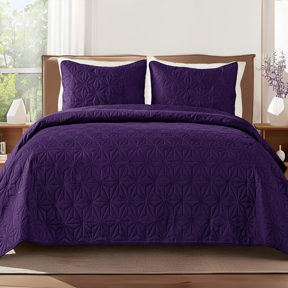 Whale Flotilla king quilt in soft purple on bed for all-season comfort