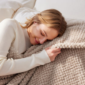 Whale Flotilla blanket on bed display for cozy bedroom scene