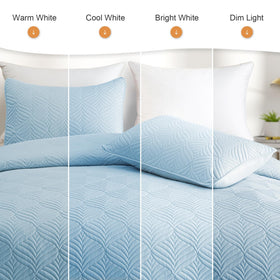 Whale Flotilla reversible coverlet offers two looks in one lightweight layer.