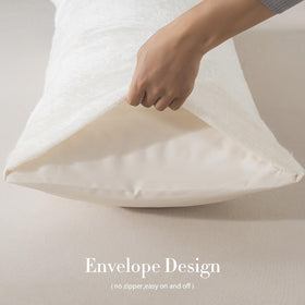 WhatsBedding full body pillow on bed supporting back and hips for comfortable lounging.