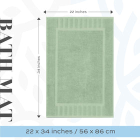 Green bath mat laid beside sink showcasing generous coverage