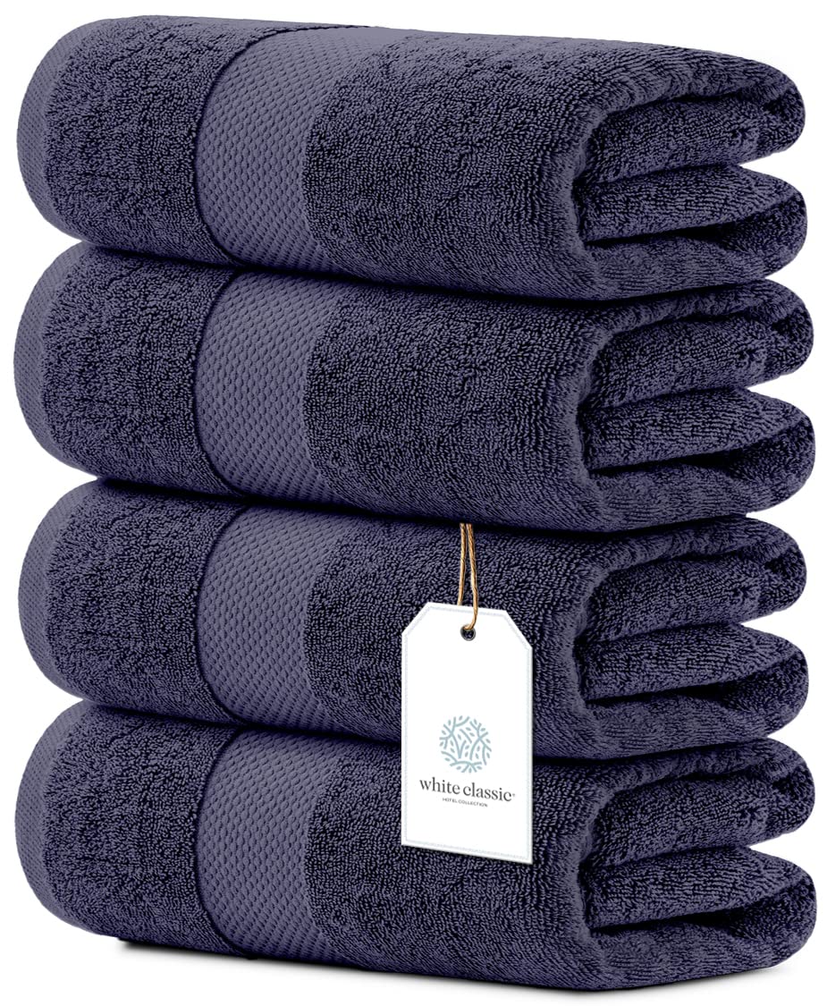 White Classic navy towels neatly folded for spa-like bathroom
